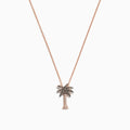 A Novelty 14K Rose Gold Diamond Palm Tree Pendant (0.10 TCW) necklace is shown on a delicate chain, with sparkling stones, displayed against a white background.