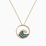 The Seaside 14K Yellow Gold Blue & White Diamond Wave Pendant (0.53 TCW) features a circular charm with a wave design, set with blue and white diamonds, and is displayed against a plain white background.