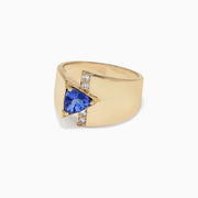 The Nahla Siri 14K yellow gold ring features a 0.74 TCW off-center triangular tanzanite and a vertical row of five round white diamonds, shown on a plain white background.