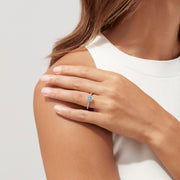 The Aquarius 14K White Gold Aquamarine and Diamond Ring, 1.09 TCW, showcases a round pale blue aquamarine center stone with sparkling diamonds along the band, presented on a white background.