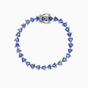 The Nahla Siri Sterling Silver Tanzanite Tennis Bracelet, 11.40 TCW, features a circle of evenly spaced triangular tanzanite gemstones and is finished with a secure clasp.