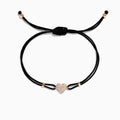 The Novelty 14K Rose Gold Diamond Heart String Bracelet features an adjustable black cord, a central rose gold heart with 0.13 TCW diamonds, and gold accents at the cords ends.
