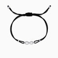 The Novelty 14K White Gold Diamond Infinity String Bracelet, 0.11 TCW, features a black adjustable cord with a diamond-studded infinity symbol at the center and silver bead accents at each end.