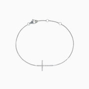 Novelty 14K White Gold Diamond Cross Bracelet, 0.09, showcases a horizontal cross accented with sparkling diamonds and is finished with a secure lobster clasp.