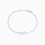 The Novelty 14K White Gold Diamond Infinity Bracelet, 0.12 TCW, features a sparkling infinity symbol on a delicate chain with clasp closure and three adjustable loops for an ideal fit.