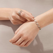 The Duo 14K White and Yellow Gold Diamond Chain Link Tennis Bracelet, 2.01 TCW, features alternating gold and silver oval links with sparkling diamonds, displayed elegantly on a white background.