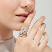 The Classique 14K White Gold Diamond Knot Ring, 1.67 TCW, features an intricate, swirling design with baguette and round-cut diamonds, beautifully displayed on a white background.