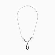 The 14K White Gold Black and White Diamond Necklace, 1.46 TCW, features an abstract teardrop pendant with intertwining black and silver loops, adorned with sparkling black and white diamonds.