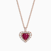 The Ruby Royale 14K Rose Gold Heart Shaped Ruby Pendant (1.28 TCW) features a romantic ruby centerpiece, accented by sparkling diamonds on a delicate rose gold chain for an elegant touch.