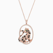 The Signature 14K Rose Gold Diamond and Emerald Panther Pendant (1.75 TCW) features an oval panther design with dazzling diamond accents, sparkling white and black stones, vibrant green gem eyes, all suspended from a delicate chain.
