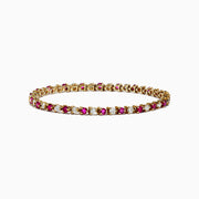 The 14K Yellow Gold Ruby and Diamond Tennis Bracelet, 3.85 TCW, showcases alternating round rubies and white diamonds set in a single elegant row.