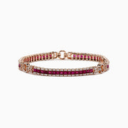 The Ruby Royale 14K Rose Gold Tennis Bracelet features princess cut rubies bordered by sparkling white diamonds, totaling 7.66 TCW, for a striking look against the white background.