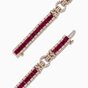The Ruby Royale 14K Rose Gold Tennis Bracelet features princess cut rubies bordered by sparkling white diamonds, totaling 7.66 TCW, for a striking look against the white background.