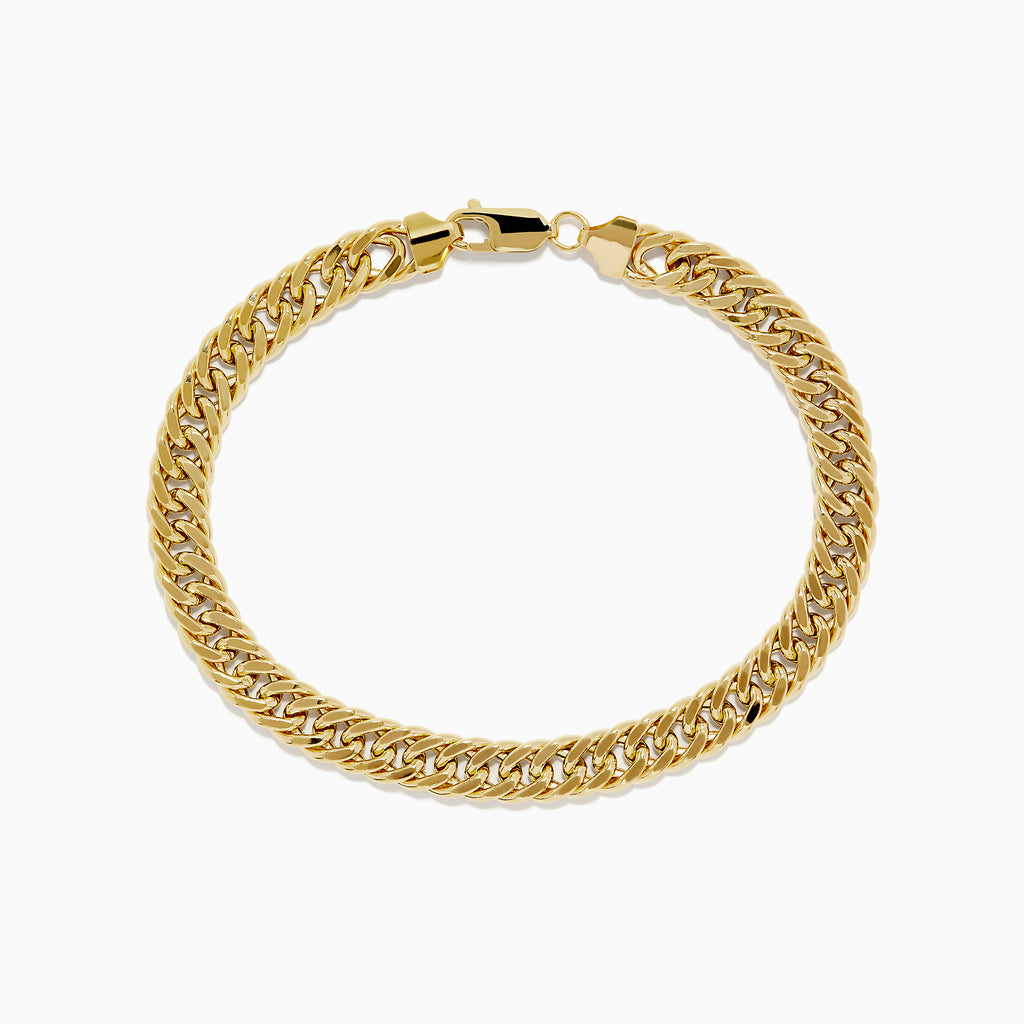 The 14K Two-Tone Yellow and White Gold Reversible Curb Chain Link Bracelet (9) features tightly linked flat curb chains and a secure clasp, shown arranged in a circle on a white background.