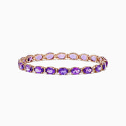 A stunning 14K rose gold amethyst and diamond bracelet featuring a continuous row of oval-cut purple gemstones set in individual prongs around the band—a signature Effy design.