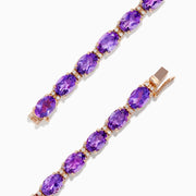 A stunning 14K rose gold amethyst and diamond bracelet featuring a continuous row of oval-cut purple gemstones set in individual prongs around the band—a signature Effy design.