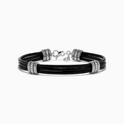 The Mens 925 Sterling Silver and Leather Bracelet features black leather bands, sterling silver-tone accents, decorative silver rings, and a secure lobster clasp—a stylish accessory for any occasion.