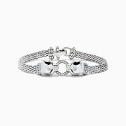 The Signature Sterling Silver Diamond and Tsavorite Panther Bracelet, 0.16 TCW, features a woven chain, two polished panther head clasps facing each other, and a circular diamond-studded link for an elegant statement look.
