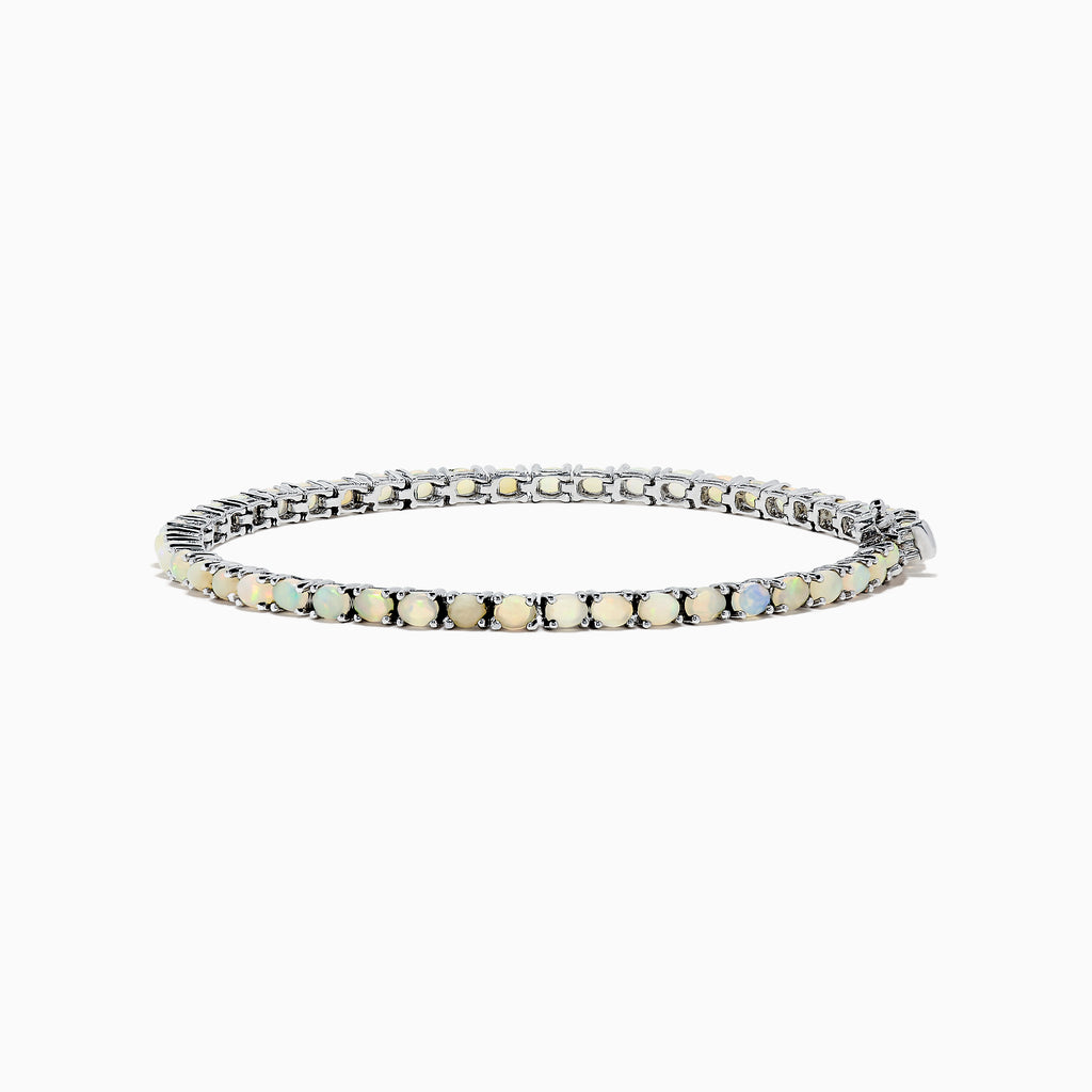 The 925 Sterling Silver Opal Tennis Bracelet features round opals totaling 4.50 TCW, each set in individual prongs and elegantly showcased on a white background.