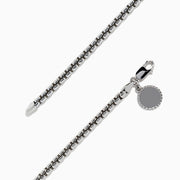 The Mens Sterling Silver 8 Box Link Bracelet features a round blank charm near the clasp and is displayed against a white background.