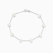 The 14K White Gold Cultured Fresh Water Pearl Station Bracelet features evenly spaced pearls and a lobster clasp, shown on a white background.