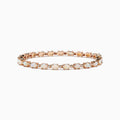 The Aurora 14K Rose Gold Opal Tennis Bracelet, 4.72 TCW, showcases round white opals set in a continuous line along a rose gold band for an elegant look.