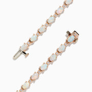 The Aurora 14K Rose Gold Opal Tennis Bracelet, 4.72 TCW, showcases round white opals set in a continuous line along a rose gold band for an elegant look.