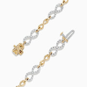 The Duo 14K Two Tone Gold Diamond Infinity Tennis Bracelet 0.53 TCW features alternating twisted gold and silver links, each set with sparkling diamonds, displayed on a plain white background.