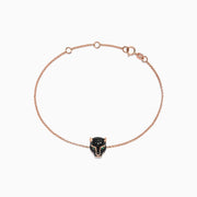 The Signature 14K Rose Gold Black Diamond & Emerald Bracelet, 0.44 TCW, features a delicate chain with a panther head charm set with black diamonds and emeralds, shown on a plain white background.