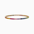 The Watercolors 14K Yellow Gold Multi Sapphire Tennis Bracelet, 5.51 TCW, features a continuous row of rainbow gradient sapphires set in yellow gold, elegantly displayed on a plain white background.