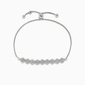 The 925 Sterling Silver Diamond Bolo Bracelet features an adjustable sliding clasp and nine round diamond-studded clusters at the center, totaling 0.22 TCW.