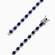 The Royale Bleu 14K Gold Sapphire and Diamond Tennis Bracelet, 4.24 TCW, showcases alternating round blue sapphires and diamonds, elegantly displayed on a white background.