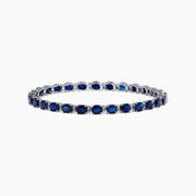 The Royale Bleu 14K Gold Sapphire & Diamond Tennis Bracelet features a continuous row of oval sapphires and diamonds, totaling 12.21 TCW, set in prongs for an elegant and timeless look.