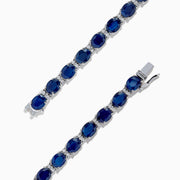 The Royale Bleu 14K Gold Sapphire & Diamond Tennis Bracelet features a continuous row of oval sapphires and diamonds, totaling 12.21 TCW, set in prongs for an elegant and timeless look.