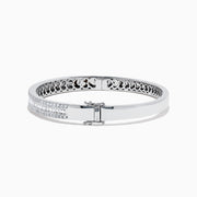 The Classique 14K White Gold Diamond Bangle 2.41 TCW features two rows of sparkling diamonds along the front and an intricate cutout interior, blending elegance and craftsmanship from the Effy Classique collection.