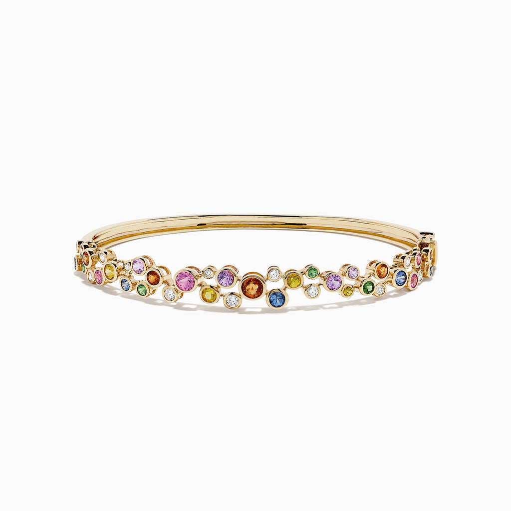 The Watercolors 14K Gold Multi Sapphire and Diamond Bangle, 2.80 TCW, features a scattered array of pink, blue, green, orange, and clear gemstones with diamonds for a vibrant, organic look.