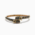 The Safari 14K Yellow Gold Black Diamond Dragon Bangle showcases a detailed dragon design with black scale patterns and gold accents, featuring the dragon’s head and claws as the clasp for a bold, mythical touch.