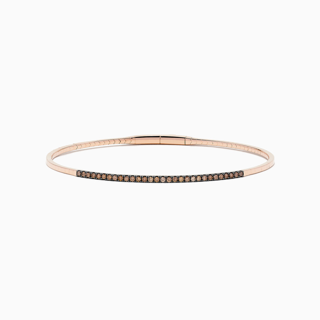 The 14K Rose Gold Espresso Diamond Bangle features a slim, polished design with a row of dark espresso diamonds set along the front for a minimalist, elegant look.