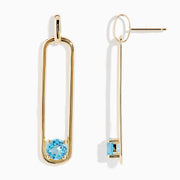 14K Yellow Gold Paperclip Blue Topaz Drop Earrings feature a minimalist, elongated design, each adorned with a round blue topaz at the bottom for effortless elegance.