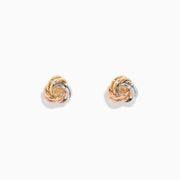 The 14K Three Color Gold Double Love Knot Earrings showcase intertwined gold, silver, and rose gold loops in a classic knot design, set against a plain white background.