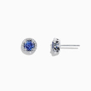 The Nahla Siri 14K White Gold Tanzanite and Diamond Stud Earrings, 1.04 TCW, feature vivid blue tanzanites encircled by sparkling diamonds in a polished white gold setting.