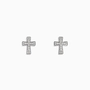 The 925 Sterling Silver Diamond Cross Stud Earrings are small, sterling silver cross-shaped studs adorned with sparkling gemstones, shown on a white background.