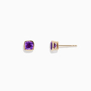 A pair of 14K Yellow Gold Amethyst Stud Earrings featuring square-cut purple gemstones, shown on a plain white background.