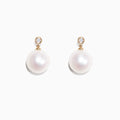 A pair of 14K yellow gold earrings with cultured freshwater pearls and sparkling diamonds (0.05 TCW), displayed on a white background.