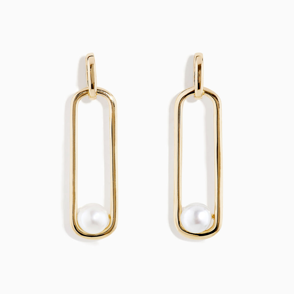 The 14K Yellow Gold Paperclip Cultured Freshwater Pearl Earrings feature elongated oval hoops in yellow gold, each adorned with a single freshwater pearl at the bottom, displayed on a plain white background.