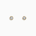 The 14K Two-Tone Gold Bezel Set Diamond Solitaire Stud Earrings (0.23 TCW) feature sparkling diamonds in a classic bezel setting, reminiscent of timeless solitaires, showcased against a plain white background.