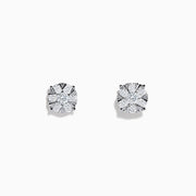 The 14K White Gold Diamond Cluster Stud Earrings, 1.01 TCW, shimmer with radiant facets in a classic prong setting, shown against a plain white background.