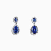 Nahla Siri 14K Gold Tanzanite and Diamond Earrings, 2.90 TCW, showcase elegant oval and teardrop blue tanzanites bordered by sparkling diamonds in a 14K gold setting on a white background.