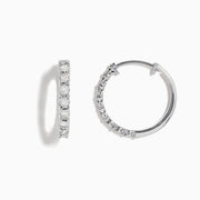 A pair of 925 Sterling Silver Diamond Hoop Earrings, each adorned with a row of sparkling white gemstones, displayed against a white background—an elegant choice for any jewelry collection.