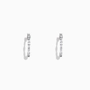 The Classique 14K White Gold Diamond Hoop Earrings, 0.37 TCW, feature delicate hoops each set with sparkling round diamonds and are shown against a plain white background.